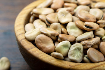dry broad beans in a wooden plate