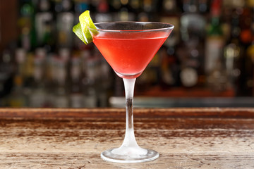 Cocktail cosmopolitan in a frozen glass. Refreshing drink for the summer. Place for text.