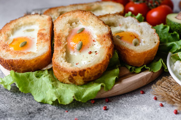 Delicious breakfast with grunts, eggs, avocado and cherry tomatoes