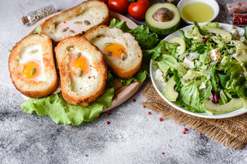 Delicious breakfast with grunts, eggs, avocado and cherry tomatoes