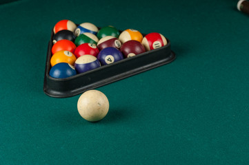 Billiards balls and cue on billiards table. Billiard sport concept