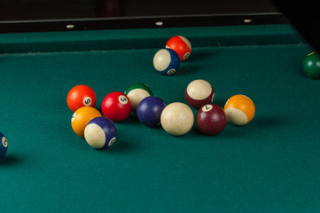 Billiards balls and cue on billiards table. Billiard sport concept