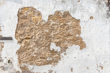 Old wall with cracked plaster or lime. Background texture