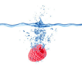 Raspberry falling in water isolated on white background.