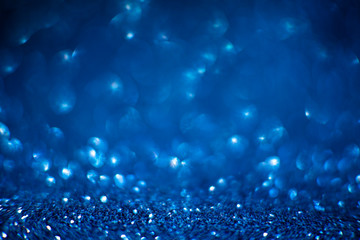 Abstract blue glitter background. Shiny glitter bokeh christmas background