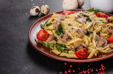 Pasta with mushrooms, cheese, spinach, rukkola and cherry tomatoes