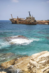 Paphos. Shipwreck. The ship crashed on the coastal rocks at the shore of the Mediterranean sea....