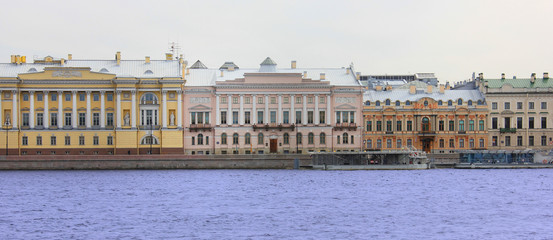 Saint-Petersburg cityscape scenic view with old historic buildings on Neva river in Russia. Decorative residential house facades in Saint Petersburg city downtown. European old townscape scenery