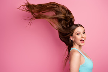 Portrait of her she nice attractive lovely cheerful cheery straight-haired girl ideal perfect clean smooth hair flying anti dander dandruff medicine isolated on pink pastel color background