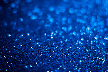 Naklejka na ściany i meble Abstract blue glitter background. Shiny glitter bokeh christmas background