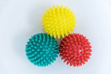 photos of massage balls of different colors. Association with coronavirus. concept. adaptation mutation and variability. The view from the top