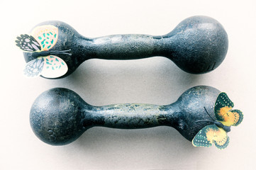 Vintage cast iron dumbbells weighing 3 kg with butterflies