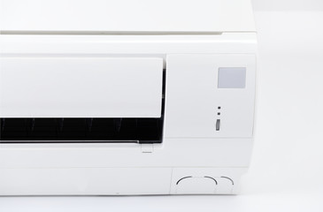 Air conditioner system on white wall room. Air conditioning.A white air conditioner is installed on a white wall in the apartment.
