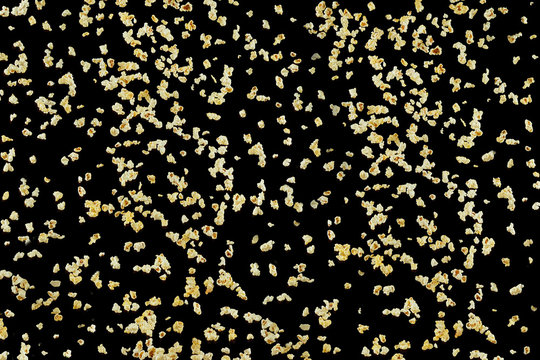 Flying prepared popcorn isolated on the black background, - Powered by Adobe