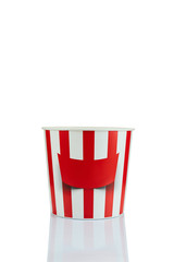 empty classic red and white paper striped bucket for popcorn isolated over the white background.