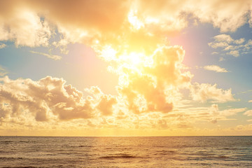 Fototapeta na wymiar Bright sunset over calm sea water - minimalist landscape