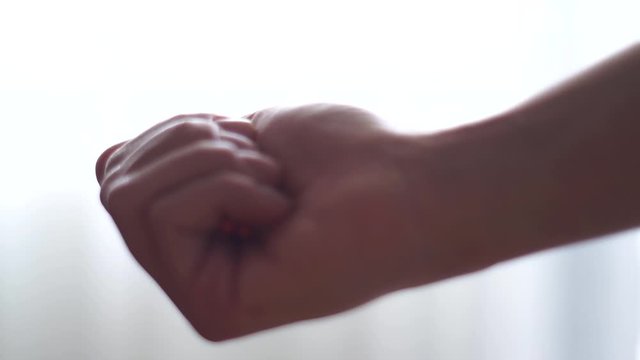 Person holding medication in their hand
