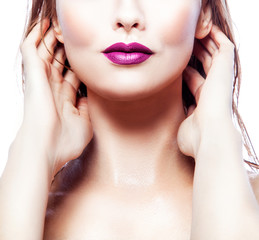 Fototapeta premium Purple lips. Part of face of beauty model woman and beautiful neck. Bright make-up, clean fresh skin. Isolated over white background