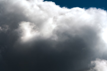 Fototapeta premium storm clouds gather in the blue sky