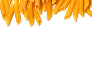 Fototapeta premium Penne pasta isolated with copy space. Raw macaroni isolated on white background.