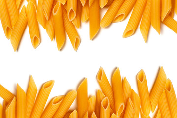 Penne pasta isolated with copy space. Raw macaroni isolated on white background.
