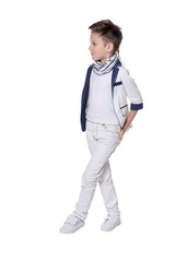 Portrait of cute boy, posing against white background