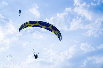 Fethiye, Mugla/Turkey- August 19 2018: Bottom up view of tandem paragliders on sky.