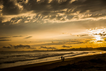 Summer sunrise in Platja Llarga beach, Tarragona, Spain