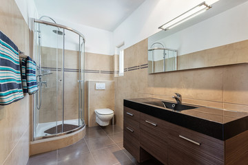 Modern shower room with a booth. European hotel design.