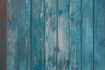 Fototapeta na wymiar Natural backdrop. Old Weathered Shabby Blue Wooden. Narrow wooden boards in blue. Turquoise wooden fence vertical planks of wood. vintage texture