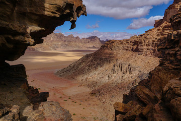 WADI RUM DESERT, JORDAN - FEBRUARY 08, 2020: View towards Rum village from the rocks of Jebel Ishrin