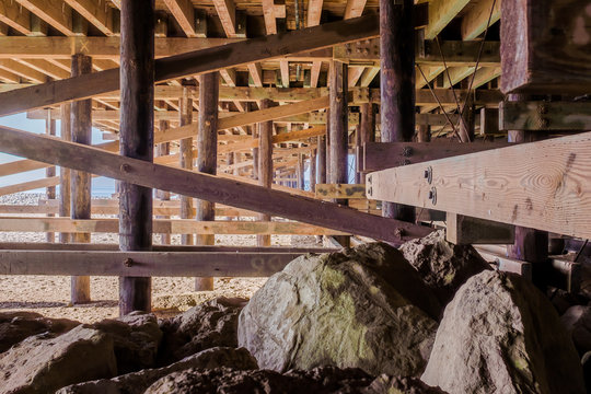 Rocks And Poles Under Pier © simon davies/EyeEm