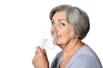 Portrait of elderly woman with flu inhalation isolated 