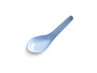 blue plastic soup spoon on white background