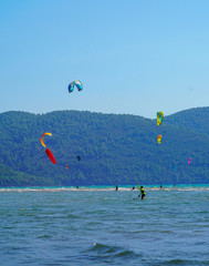 Akyaka, Mugla/Turkey-August 14 2018: Many surfers enjoying kite surfing at the beach where Azmak River meets the Mediterranean Sea
