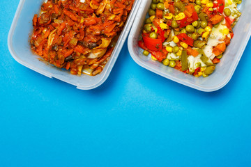 Braised pasta with vegetables in a plastic tray. Lunch for the office worker