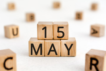 May 15 - from wooden blocks with letters, important date concept, white background random letters around