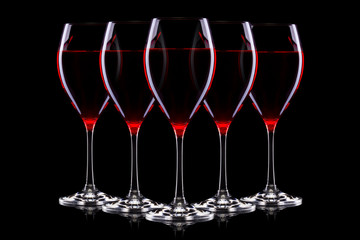 Set of glasses for red wine on black background.