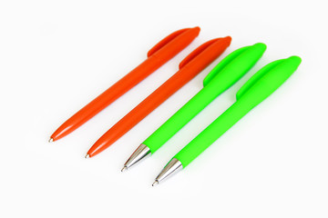 multi-colored stationery plastic writing pens on a white background