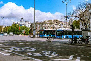 Madrid / Spain-04/19/20 Public transport buses in the Plaza de Cibeles in Madrid, Paseo de la...