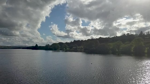 clouds over lake bank aerial