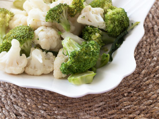 Delicious vegetables in white plate. Broccoli and cauliflower on a white plate