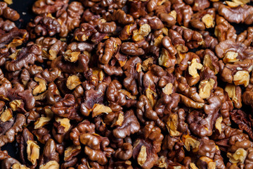  Roasted walnuts. Nuts help the brain work. Fatigue Food, Healthy Nuts. Superfood, vegan, vegetarian food concept. Macro of walnut texture, selective focus. Healthy snack.