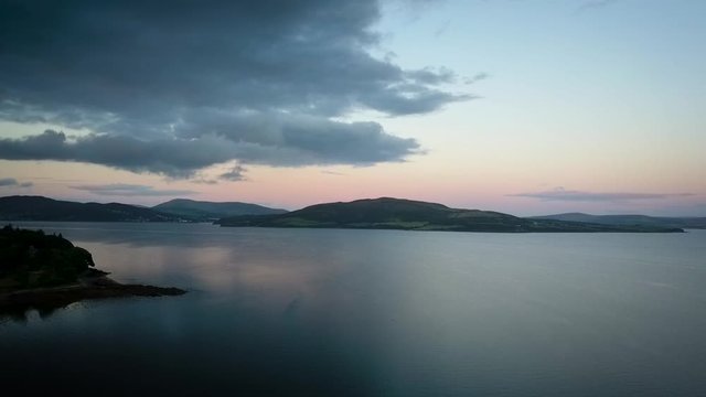 Aerial sunset over lake Ireland orbit