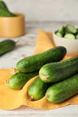 Green cucumbers on wooden table