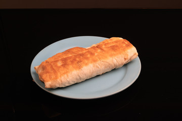 Shaurma is a dish of pita bread stuffed with meat and vegetables.