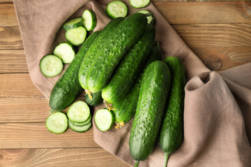 Green cucumbers on wooden table