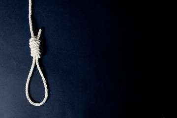 white rope gallows on black background