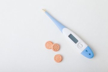Electronic thermometer and orange pills