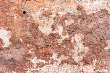 Texture of a concrete wall with cracks and scratches which can be used as a background